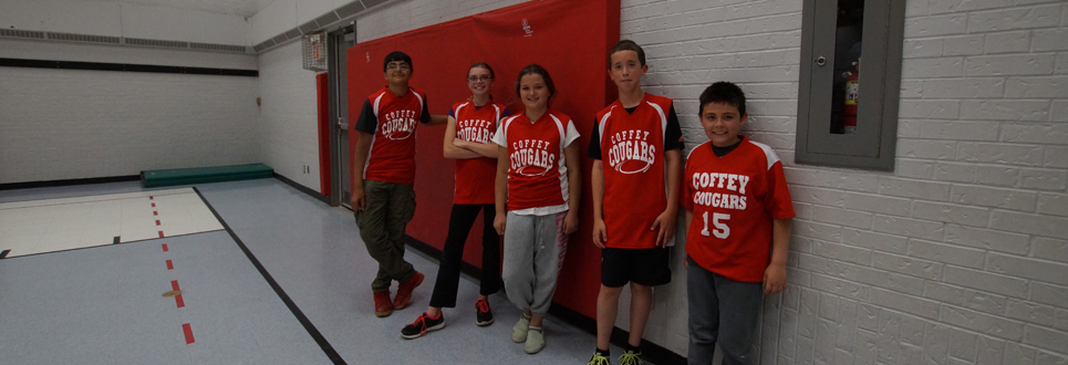 Students wearing red shirts in the gym