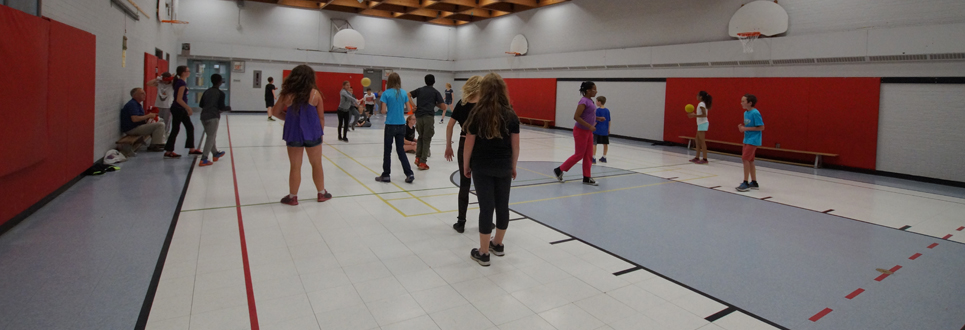 Grade 6 class doing activities in the gym.